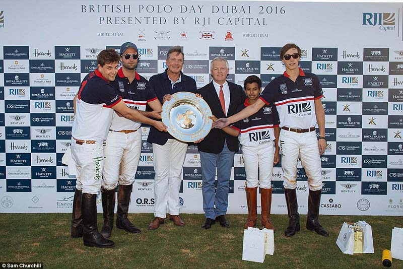 RJI Capital Oxbridge - which featured professional players Max Kirchhoff (second from left) and Jack Richardson (right) - are awarded their winning plate
